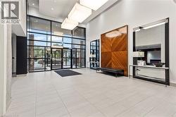 Lobby with a towering ceiling and floor to ceiling windows - 