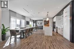 Dining area with wood finished floors and recessed lighting - 