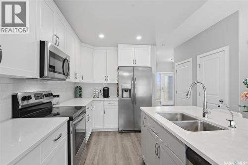242 Brighton Gate, Saskatoon, SK - Indoor Photo Showing Kitchen With Double Sink With Upgraded Kitchen