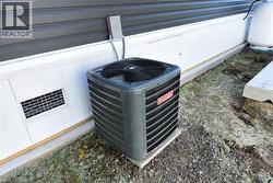 Exterior view of a cooling unit and heating fuel tank - 