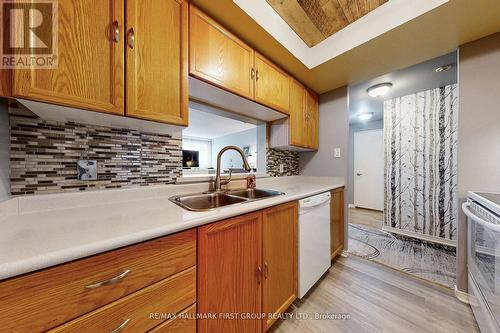 218 - 8351 Mclaughlin Road S, Brampton, ON - Indoor Photo Showing Kitchen With Double Sink