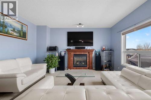 72 Rockyspring Circle Nw, Calgary, AB - Indoor Photo Showing Living Room With Fireplace