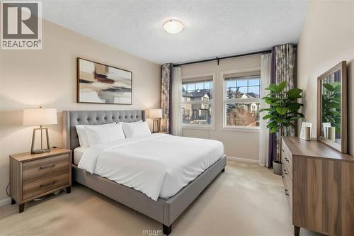 72 Rockyspring Circle Nw, Calgary, AB - Indoor Photo Showing Bedroom
