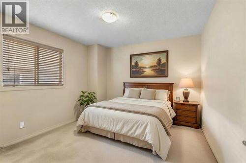 72 Rockyspring Circle Nw, Calgary, AB - Indoor Photo Showing Bedroom