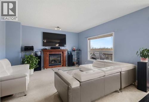 72 Rockyspring Circle Nw, Calgary, AB - Indoor Photo Showing Living Room With Fireplace