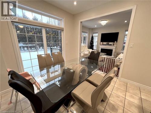 Dining area with light tile patterned floors, a fireplace, and recessed lighting - 24 Hazelton Avenue, Hamilton, ON - Indoor With Fireplace