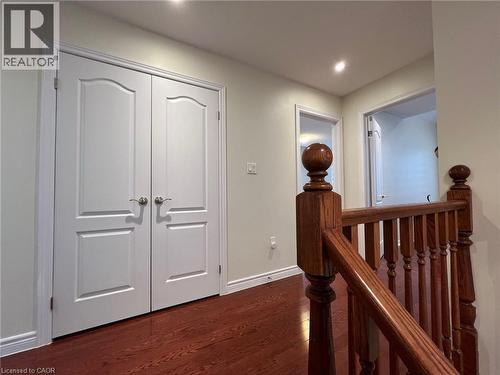 Corridor featuring an upstairs landing, dark wood-type flooring, and recessed lighting - 24 Hazelton Avenue, Hamilton, ON - Indoor Photo Showing Other Room