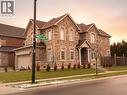 View of front facade featuring a garage, brick siding, driveway, and a shingled roof - 24 Hazelton Avenue, Hamilton, ON  - Outdoor With Facade 