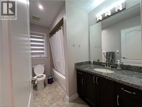 Bathroom featuring vanity and shower / bath combo - 24 Hazelton Avenue, Hamilton, ON - Indoor Photo Showing Bathroom