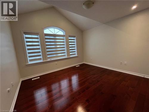 Unfurnished room featuring lofted ceiling and dark wood-style floors - 24 Hazelton Avenue, Hamilton, ON - Indoor Photo Showing Other Room