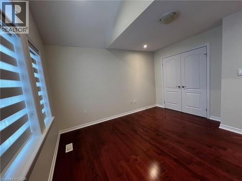 Unfurnished bedroom with dark wood finished floors, a closet, and recessed lighting - 24 Hazelton Avenue, Hamilton, ON - Indoor Photo Showing Other Room