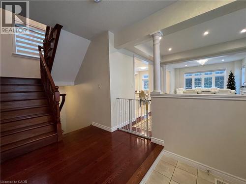 Stairs with decorative columns, tile patterned flooring, and recessed lighting - 24 Hazelton Avenue, Hamilton, ON - Indoor Photo Showing Other Room