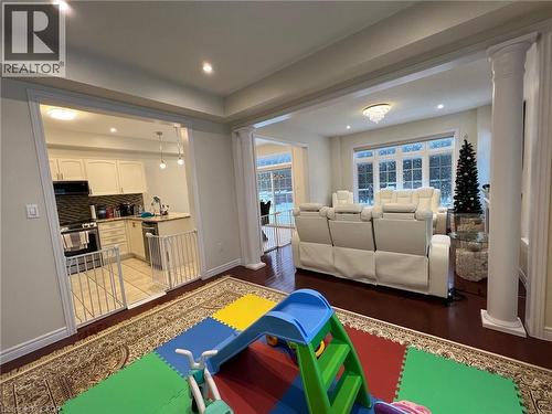 Recreation room with ornate columns, recessed lighting, and light wood finished floors - 24 Hazelton Avenue, Hamilton, ON - Indoor Photo Showing Living Room