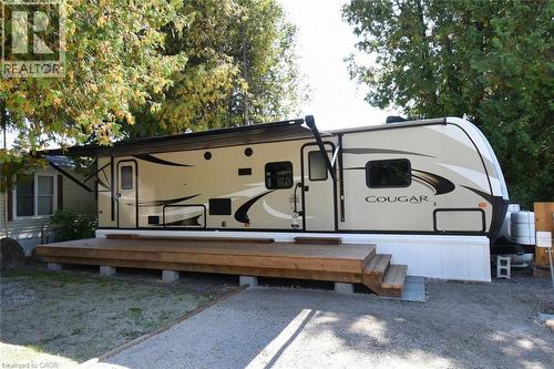 Rear view of house featuring a deck - 1085 10Th Concession Road W Unit# 29, Flamborough, ON - Outdoor With Deck Patio Veranda