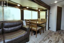 Dining area with light wood finished floors - 