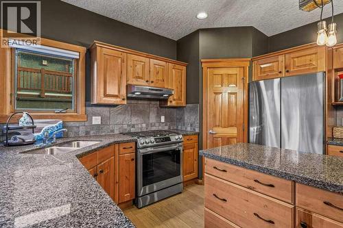 215 Miskow Close, Canmore, AB - Indoor Photo Showing Kitchen With Double Sink