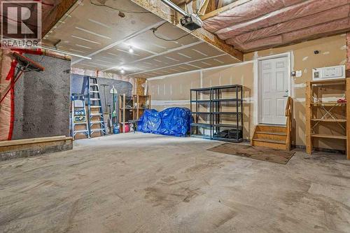 215 Miskow Close, Canmore, AB - Indoor Photo Showing Garage