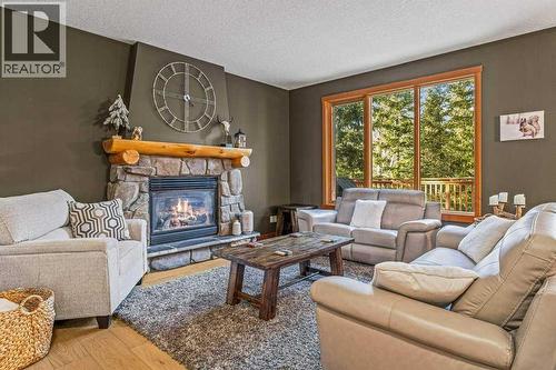 215 Miskow Close, Canmore, AB - Indoor Photo Showing Living Room With Fireplace