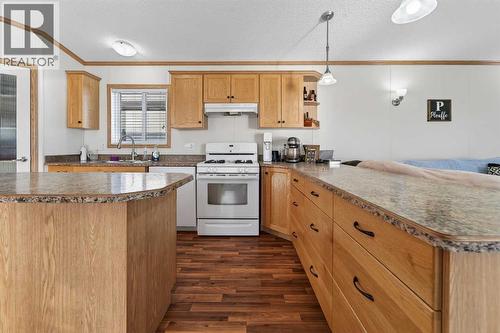 5004 Seasons Boulevard, Coaldale, AB - Indoor Photo Showing Kitchen With Double Sink