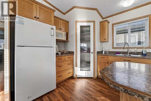 5004 Seasons Boulevard, Coaldale, AB - Indoor Photo Showing Kitchen With Double Sink