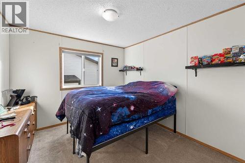 5004 Seasons Boulevard, Coaldale, AB - Indoor Photo Showing Bedroom