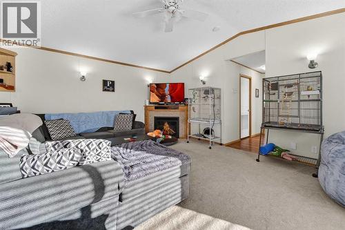 5004 Seasons Boulevard, Coaldale, AB - Indoor Photo Showing Other Room With Fireplace