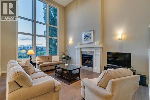 101 Cranarch Common Se, Calgary, AB - Indoor Photo Showing Living Room With Fireplace