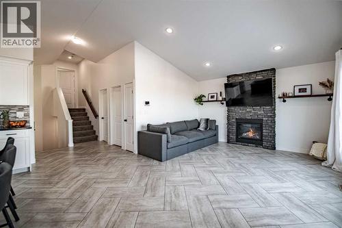 Living Room - 53 Portway Close, Blackfalds, AB - Indoor Photo Showing Living Room With Fireplace