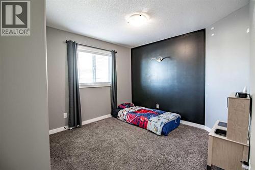 Bedroom 2 - 53 Portway Close, Blackfalds, AB - Indoor Photo Showing Bedroom