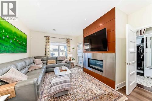 2810 25A Street Sw, Calgary, AB - Indoor Photo Showing Living Room With Fireplace