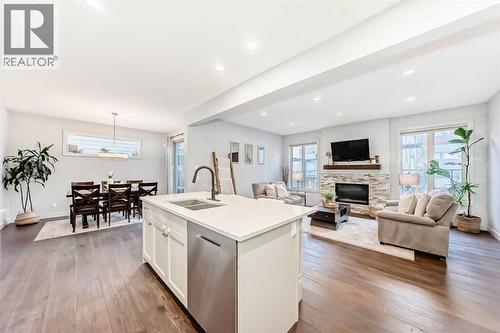 743 Shawnee Drive Sw, Calgary, AB - Indoor With Fireplace