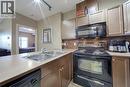 242, 52 Cranfield Link Se, Calgary, AB  - Indoor Photo Showing Kitchen With Double Sink 