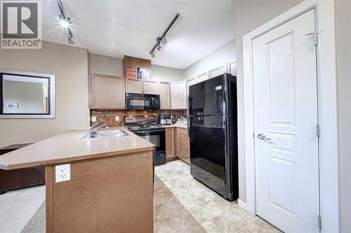 242, 52 Cranfield Link Se, Calgary, AB - Indoor Photo Showing Kitchen With Double Sink