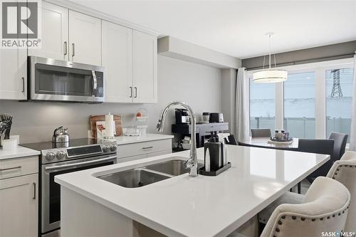 1025 Kolynchuk Crescent, Saskatoon, SK - Indoor Photo Showing Kitchen With Double Sink