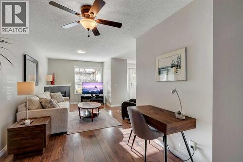 86 Eversyde Common Sw, Calgary, AB - Indoor Photo Showing Living Room