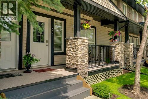 86 Eversyde Common Sw, Calgary, AB - Outdoor With Deck Patio Veranda