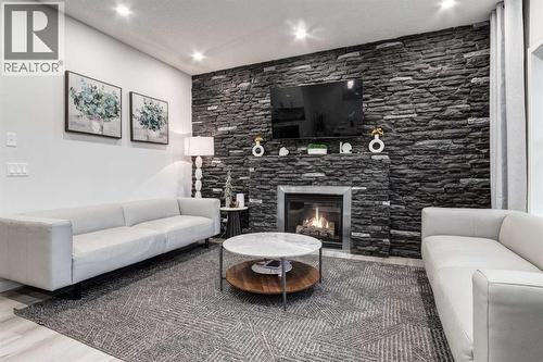 110 Sage Bank Grove Nw, Calgary, AB - Indoor Photo Showing Living Room With Fireplace