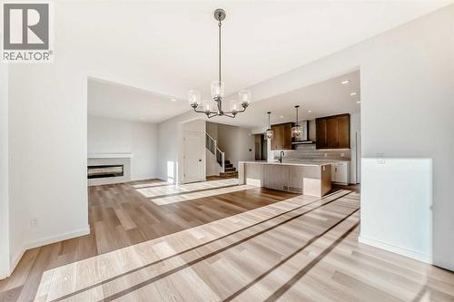 PLEASE NOTE: Kitchen appliances are included, and will be installed prior to possession - 63 Creekside Path Sw, Calgary, AB - Indoor With Fireplace