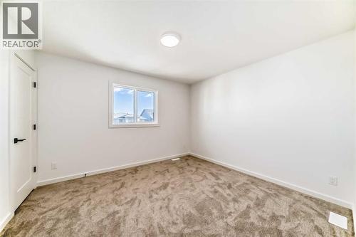 63 Creekside Path Sw, Calgary, AB - Indoor Photo Showing Other Room