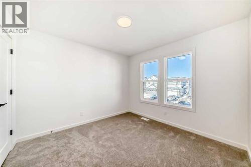 63 Creekside Path Sw, Calgary, AB - Indoor Photo Showing Other Room
