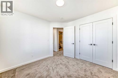 63 Creekside Path Sw, Calgary, AB - Indoor Photo Showing Other Room