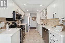 Custom Backsplash & Stainless Steel Appliances - 