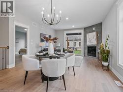 Dining area featuring a chandelier, and light coloured flooring - 
