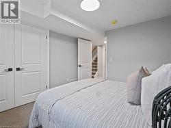 Carpeted bedroom featuring a closet - 