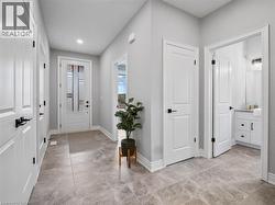 Foyer entrance featuring baseboards and recessed lighting - 