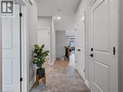 Corridor with baseboards and recessed lighting - 