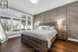 A serene primary bedroom with California Shutters - 