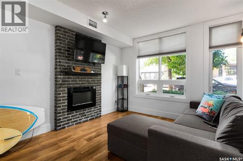 418 C Avenue S, Saskatoon, SK - Indoor Photo Showing Living Room With Fireplace
