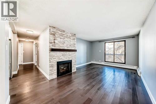 604, 537 14 Avenue Sw, Calgary, AB - Indoor Photo Showing Living Room With Fireplace