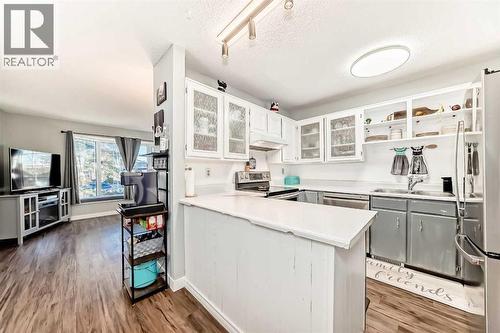 Your kitchen featuring new appliances (with transferable extended warranty) - 7840 20A Street Se, Calgary, AB - Indoor Photo Showing Kitchen With Double Sink